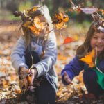Kids Play - Photo of Children Playing With Dry Leaves