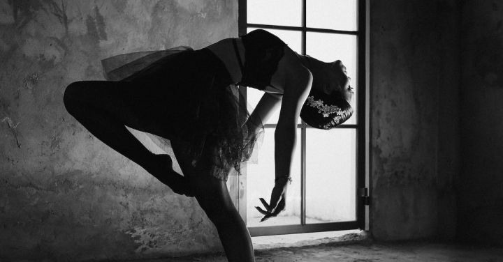 Dance Shows - Graceful ballerina dancing in house with shadow on floor