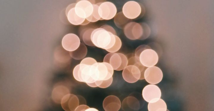 Folk Circles - Defocused Image of Illuminated Christmas Tree Against Sky