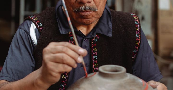 Artisan Crafts - Skilled Craftsman Putting Paint on a Pot