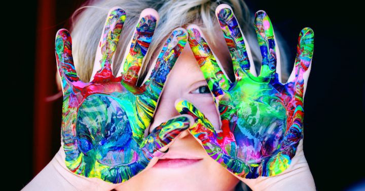 Kids Play - A KId With Multicolored Hand Paint