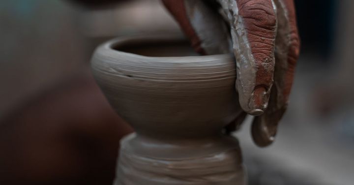 Artisan Crafts - Person Molding a Clay Pot