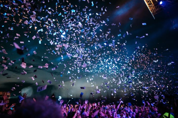 Festival - people partying with confetti