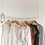Wear - assorted clothes in wooden hangers