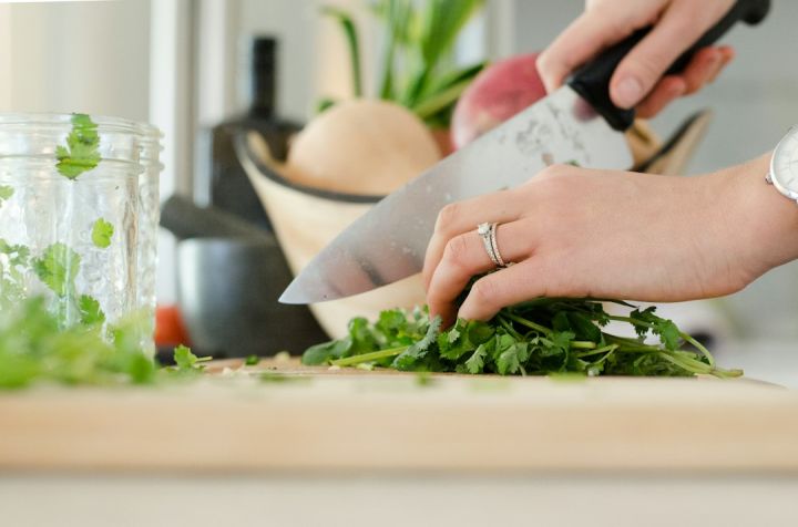 Cooking - person cutting vegetables with knife