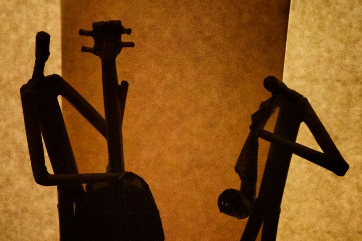 Jazz - silhouette of a person standing on a ladder