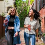 Chill Zone - woman in blue denim jacket standing beside woman in white shirt